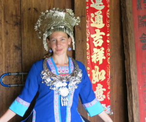 The researcher wearing a Zhuang employee's work uniform at the Black Clothes Zhuang House in the Ethnic Minorities Village, Nanning, China, 2014